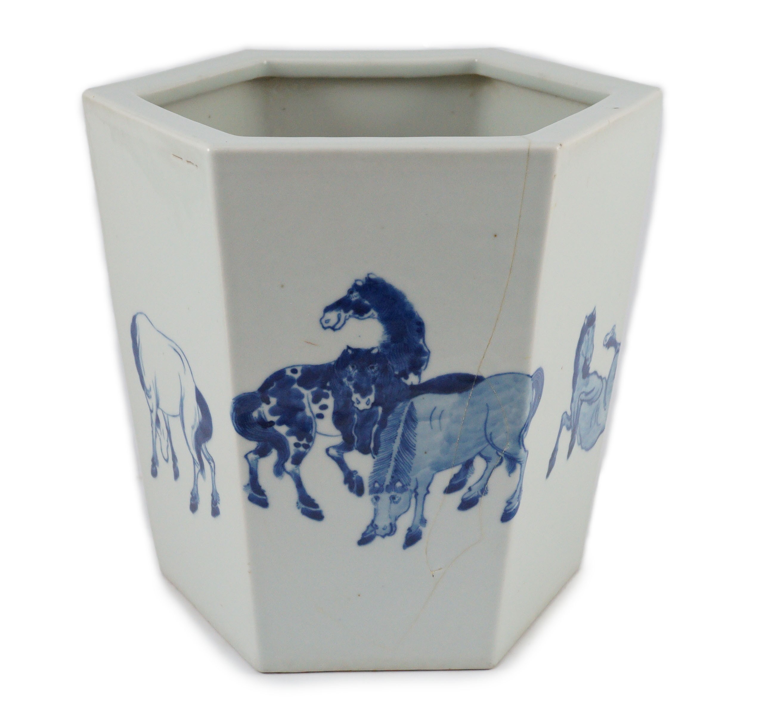 A Chinese blue and white hexagonal jardiniere, Kangxi mark but 19th/20th century, 26.5cm high, 28cm wide, cracked